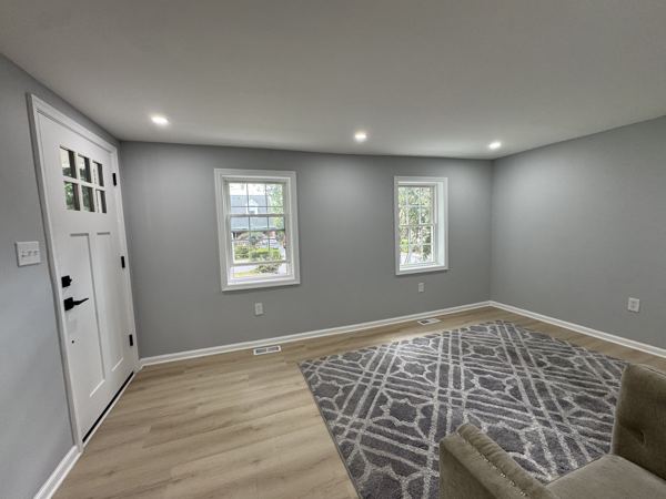 Living room with craftsman front door