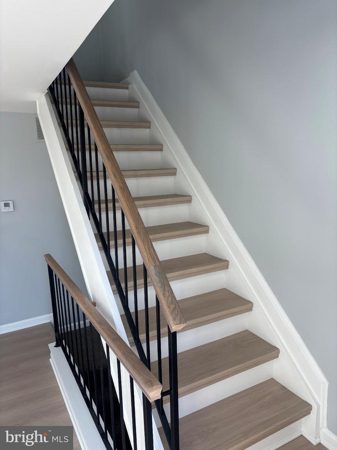 New staircase with oak rails and iron balusters