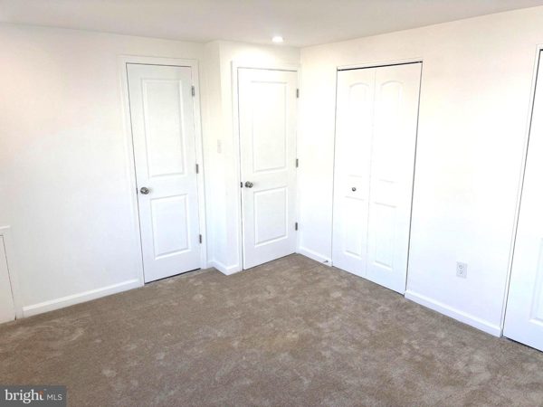Primary bedroom: his-and-hers closets