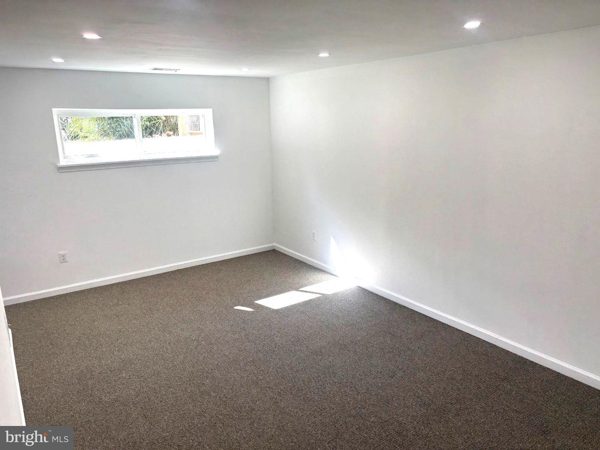 Lower-level living area with natural light